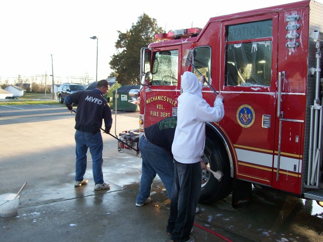 Firefighters wash Engine 23 